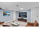 The basement is complete with a TV, furniture, and flooring creating a cozy and modern space for entertainment at 3541 N Linwood Ave, Indianapolis, IN 46218