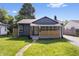 Charming single-story home featuring a welcoming front porch and fresh landscaping at 3541 N Linwood Ave, Indianapolis, IN 46218