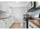 Well-equipped kitchen with stainless steel appliances and ample counter space at 3541 N Linwood Ave, Indianapolis, IN 46218