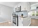 Modern kitchen with stainless steel appliances, subway tile backsplash and wood countertops at 3541 N Linwood Ave, Indianapolis, IN 46218