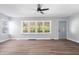 Spacious living room with natural light and wood floors with easy entry door access at 3541 N Linwood Ave, Indianapolis, IN 46218