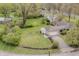 Aerial shot of the property showing a large, well-maintained yard with a fire pit at 3818 Kessler Boulevard East Dr, Indianapolis, IN 46220