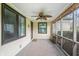 Relaxing back porch with ceiling fan, offering an outdoor retreat with natural light and views at 3818 Kessler Boulevard East Dr, Indianapolis, IN 46220