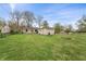 Spacious backyard with mature trees and room for outdoor activities at 3818 Kessler Boulevard East Dr, Indianapolis, IN 46220