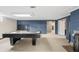 Finished basement with fireplace and pool table at 3818 Kessler Boulevard East Dr, Indianapolis, IN 46220