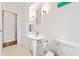 Bathroom featuring built in cabinets, a pedestal sink, and a toilet at 3818 Kessler Boulevard East Dr, Indianapolis, IN 46220