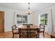 Bright dining room with hardwood floors, natural light and traditional wooden table with seating for six at 3818 Kessler Boulevard East Dr, Indianapolis, IN 46220