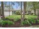 Charming stone home with a well-manicured lawn and garden, plus attached garage at 3818 Kessler Boulevard East Dr, Indianapolis, IN 46220