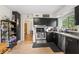 Efficient kitchen boasts black cabinets, stainless steel appliances and bright natural light at 3818 Kessler Boulevard East Dr, Indianapolis, IN 46220