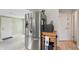 Stainless steel refrigerator with water dispenser in kitchen area with bright light and hardwood floors at 3818 Kessler Boulevard East Dr, Indianapolis, IN 46220