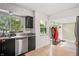 Efficient kitchen boasts black cabinets, stainless steel appliances and bright natural light at 3818 Kessler Boulevard East Dr, Indianapolis, IN 46220