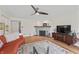 Spacious living room featuring hardwood floors, fireplace, and a comfortable seating arrangement at 3818 Kessler Boulevard East Dr, Indianapolis, IN 46220