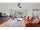A comfy orange sofa, wood floors and a big window makes this livingroom open and inviting at 3818 Kessler Boulevard East Dr, Indianapolis, IN 46220