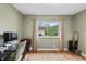 Home office with neutral walls, a large window, and wood flooring at 3818 Kessler Boulevard East Dr, Indianapolis, IN 46220