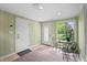 Cozy sun room with natural light, a bistro set, and views of the backyard at 3818 Kessler Boulevard East Dr, Indianapolis, IN 46220
