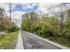 A paved walking trail winding through a lush, green neighborhood at 3818 Kessler Boulevard East Dr, Indianapolis, IN 46220