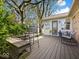 Backyard deck featuring an outdoor table set and chairs, perfect for outdoor enjoyment at 390 Lakeview Dr, Noblesville, IN 46060