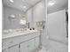 Bright bathroom with a double sink vanity, decorative tile flooring, and a shower-tub combination at 390 Lakeview Dr, Noblesville, IN 46060