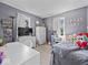Spacious bedroom featuring a comfortable bed, a white vanity, and large windows that provide natural light at 390 Lakeview Dr, Noblesville, IN 46060