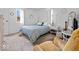 Bright bedroom featuring a cozy bed, a decorative mirror, and an accent chair that provides comfort at 390 Lakeview Dr, Noblesville, IN 46060
