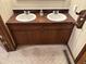 Bathroom featuring double sinks and wooden cabinets at 3920 Pigeon Creek Ln, Indianapolis, IN 46234
