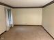 Inviting bedroom with neutral carpet, complemented by light-filled windows at 3920 Pigeon Creek Ln, Indianapolis, IN 46234