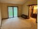Bedroom with carpet, sliding glass door, and access to the en suite bathroom at 3920 Pigeon Creek Ln, Indianapolis, IN 46234