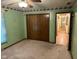 Spacious bedroom showcasing ample closet space, carpet flooring, and adjacent hallway access at 3920 Pigeon Creek Ln, Indianapolis, IN 46234