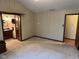 Bedroom featuring carpet and an en suite bathroom at 3920 Pigeon Creek Ln, Indianapolis, IN 46234