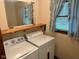 Functional laundry room equipped with washer and dryer, designed for convenience at 3920 Pigeon Creek Ln, Indianapolis, IN 46234