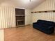 Cozy living room showcasing laminate floors and a classic brick fireplace at 3920 Pigeon Creek Ln, Indianapolis, IN 46234