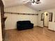 Bright living room boasting laminate floors and a brick fireplace at 3920 Pigeon Creek Ln, Indianapolis, IN 46234