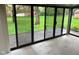 Sunroom with brick pavers and sliding glass doors leading to the backyard at 3920 Pigeon Creek Ln, Indianapolis, IN 46234