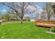 Backyard featuring a wooden deck and expansive lawn at 4464 Chatham Dr, Brownsburg, IN 46112