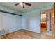 Bedroom boasts hardwood floors, light-filtering curtains, and decorative floral wallpaper at 4464 Chatham Dr, Brownsburg, IN 46112