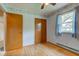 Bedroom view features hardwood floors and a closet with wooden double doors at 4464 Chatham Dr, Brownsburg, IN 46112