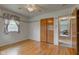Bedroom featuring hardwood floors, closet with wooden doors, and a ceiling fan at 4464 Chatham Dr, Brownsburg, IN 46112