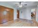 Bright bedroom with hardwood floors, ceiling fan, and spacious closet at 4464 Chatham Dr, Brownsburg, IN 46112
