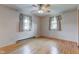 Bedroom featuring hardwood floors, ceiling fan, and bright windows at 4464 Chatham Dr, Brownsburg, IN 46112