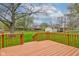 The wooden deck overlooks a well-manicured backyard with mature trees, offering a serene outdoor living space at 4464 Chatham Dr, Brownsburg, IN 46112