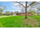 Well-maintained exterior view of the home surrounded by mature trees and green lawn at 4464 Chatham Dr, Brownsburg, IN 46112