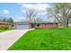 Charming brick ranch home with an attached garage and beautiful front lawn at 4464 Chatham Dr, Brownsburg, IN 46112