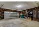 Spacious two-car garage with storage shelving and overhead lighting at 4464 Chatham Dr, Brownsburg, IN 46112