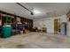 Spacious two-car garage with shelving and door to the outside at 4464 Chatham Dr, Brownsburg, IN 46112