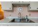 Close up of a stainless steel double basin sink and faucet at 4464 Chatham Dr, Brownsburg, IN 46112