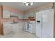 Traditional eat-in kitchen featuring white cabinets and appliances at 4464 Chatham Dr, Brownsburg, IN 46112