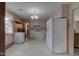 Well-lit kitchen features white cabinetry, ample counter space, and vintage appliances at 4464 Chatham Dr, Brownsburg, IN 46112