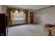 Open living area with a view of the front yard and plenty of natural light at 4464 Chatham Dr, Brownsburg, IN 46112