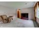 Living room with carpeting, a recliner, and a window view at 4464 Chatham Dr, Brownsburg, IN 46112