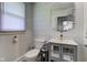 Bright bathroom with decorative mirror, modern vanity and toilet at 5014 Dawn St, Anderson, IN 46013